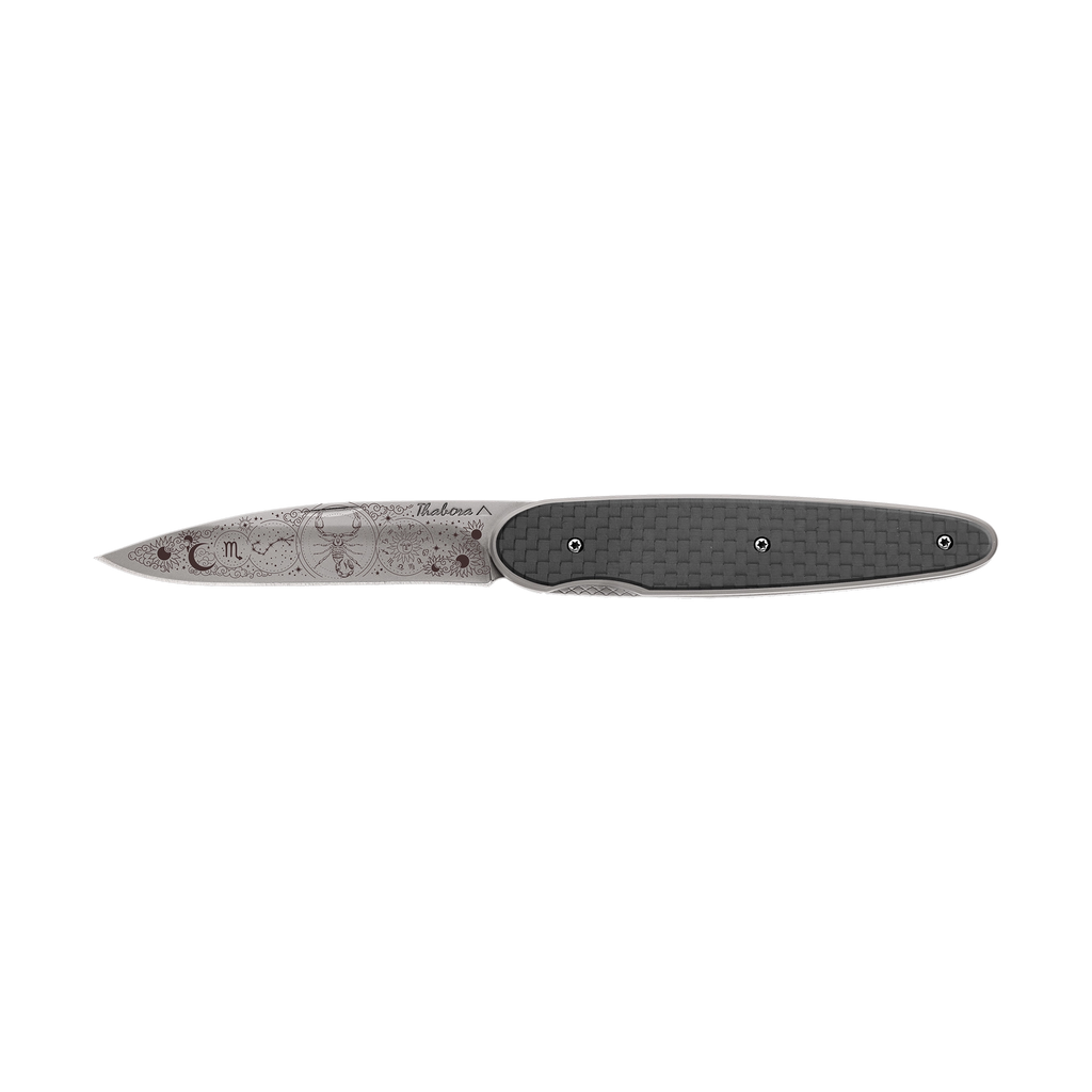 Couteau acier finition titane gris plaquette ajourée résine g10 noir motif «aigle»