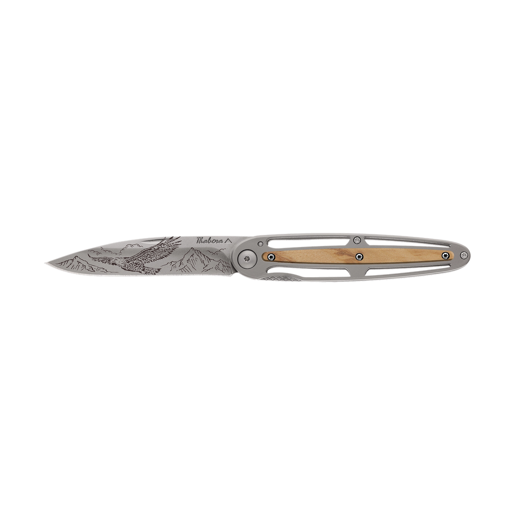 Couteau acier finition titane gris plaquette pleine résine g10 kaki motif «rugbyman»