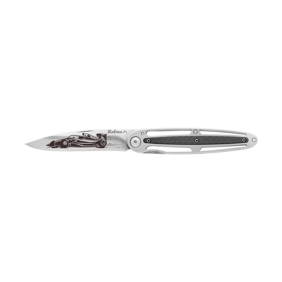 Couteau acier finition brillante plaquette centrale carbone motif «formule 1»