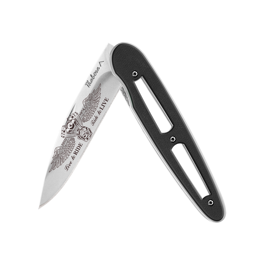 Couteau acier finition brillante plaquette ajourée résine g10 noir motif «biker ailes»