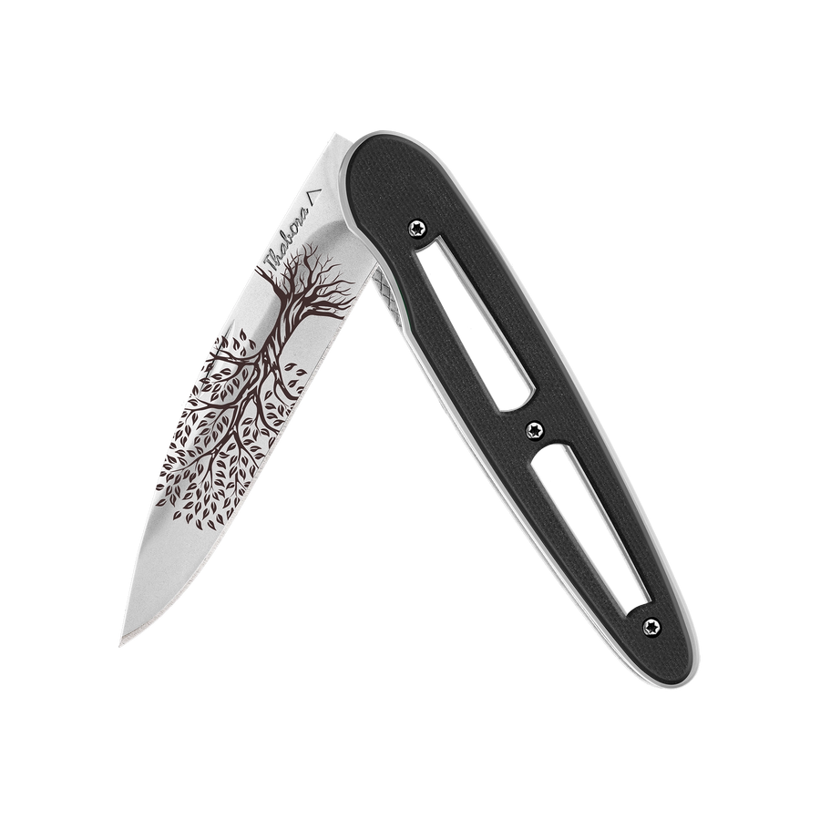 Couteau acier finition brillante plaquette ajourée résine g10 noir motif «arbre de vie»