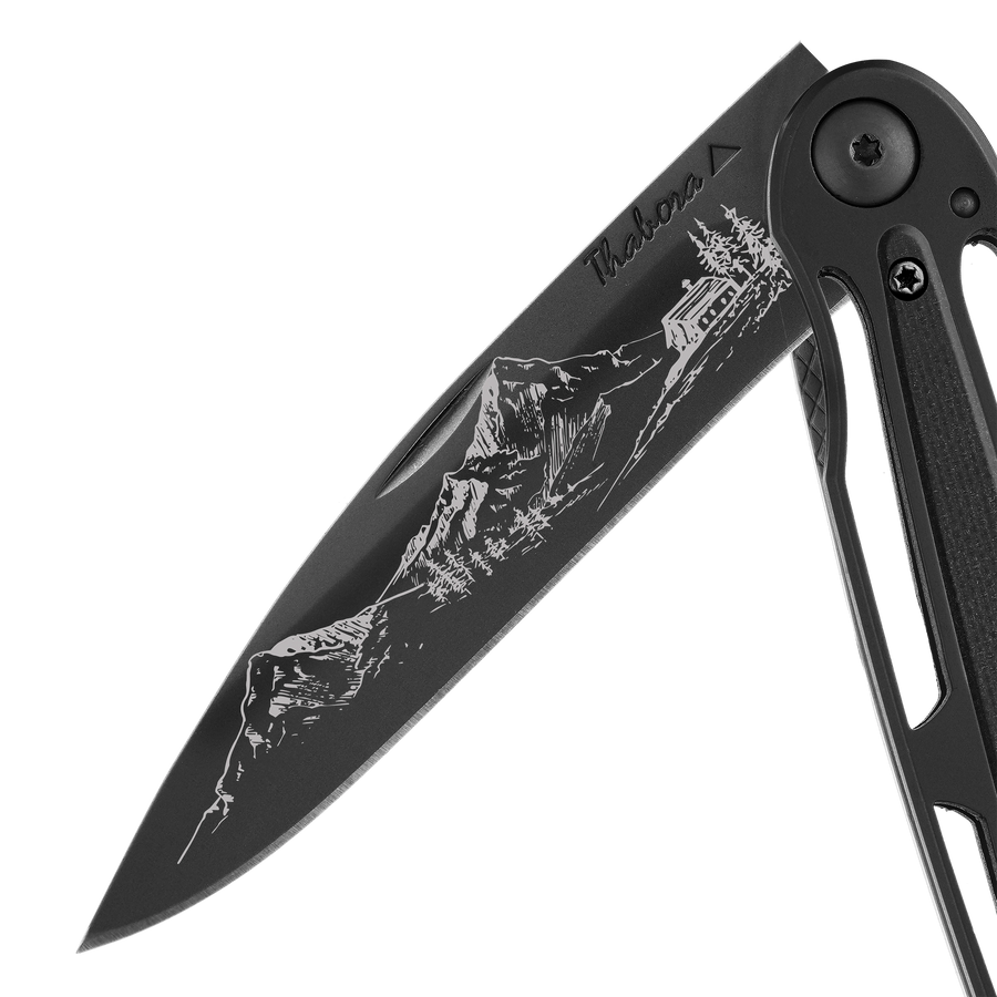 Couteau acier finition titane noir plaquette centrale résine g10 noir motif «montagne»