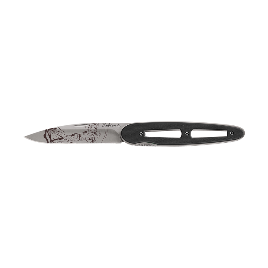 Couteau acier finition titane gris plaquette ajourée résine g10 noir motif «golfeur»