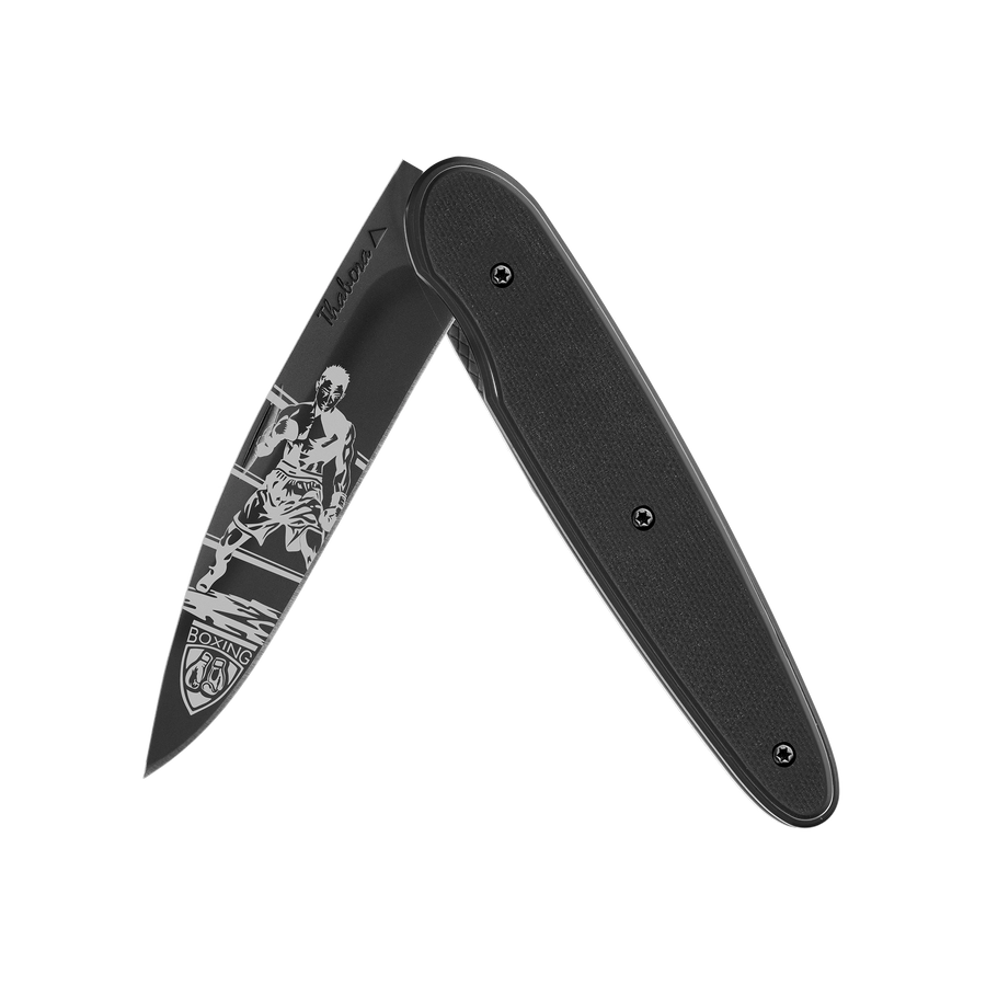 Couteau acier finition titane noir plaquette pleine résine g10 noir motif «boxeur»