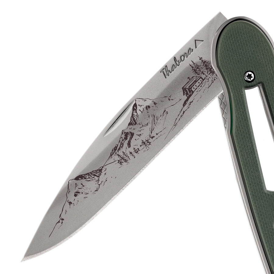 Couteau acier finition titane gris plaquette ajourée résine g10 kaki motif «montagne»