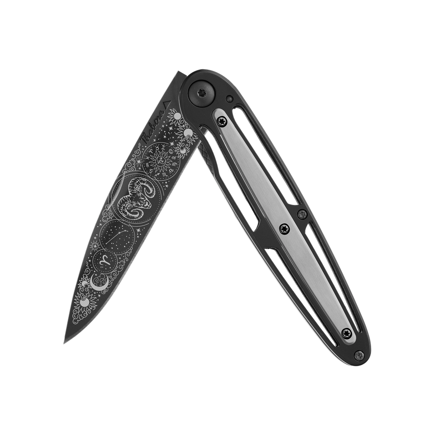 Couteau acier finition titane noir plaquette centrale acier brossé motif «zodiaque bélier»
