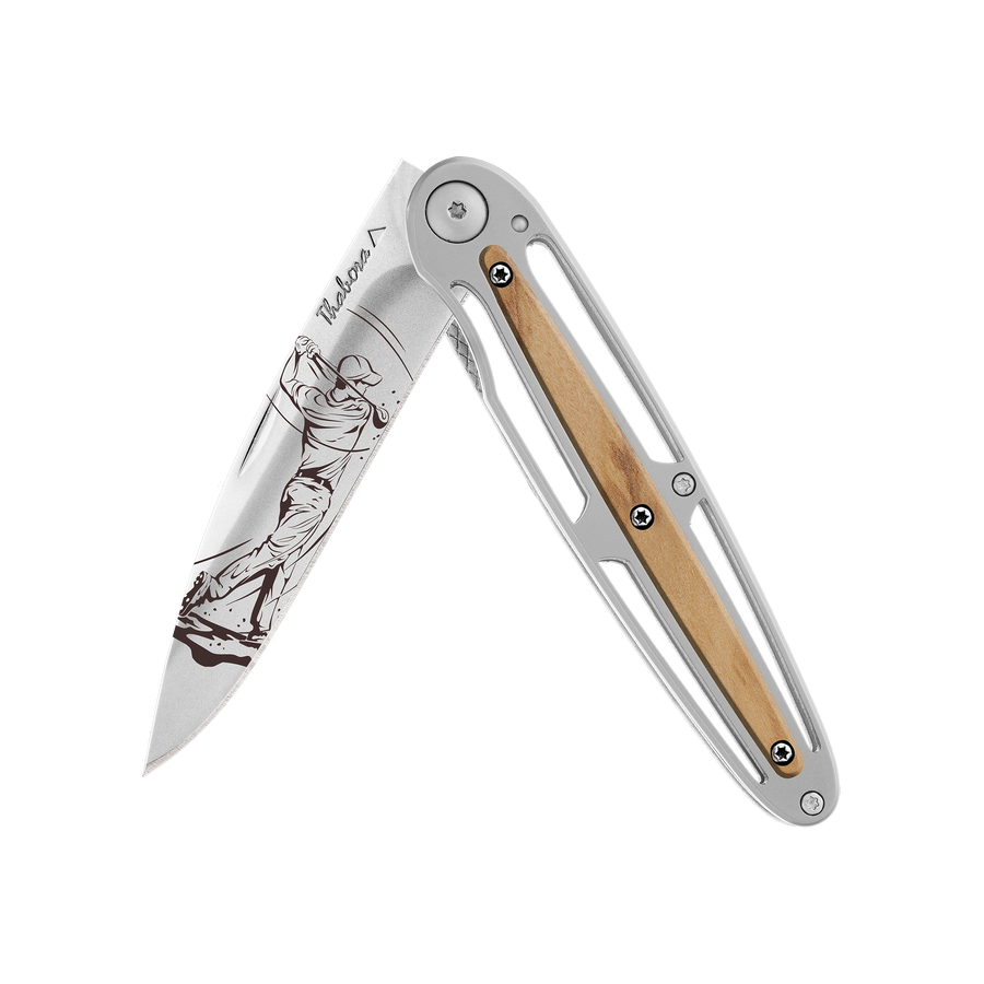 Couteau acier finition brillante plaquette centrale bois clair motif «golfeur»
