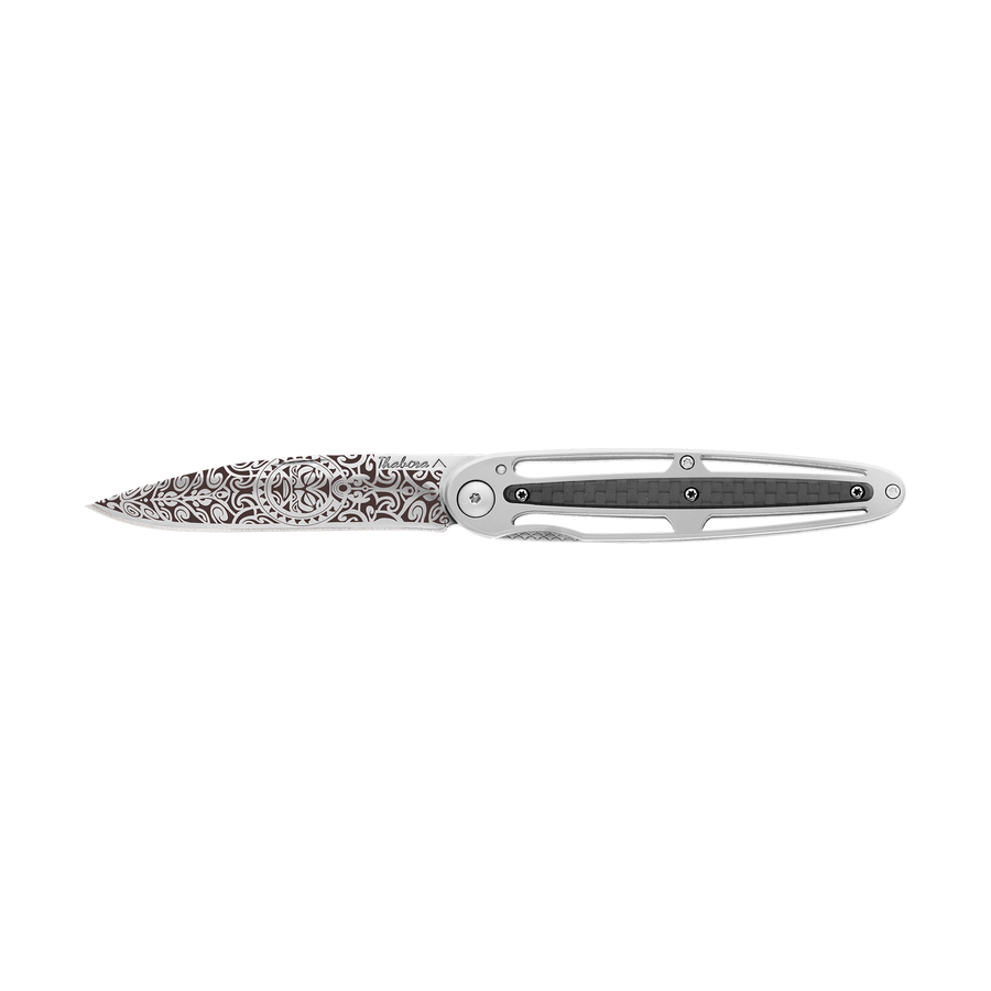 Couteau acier finition brillante plaquette centrale carbone motif «tiki»