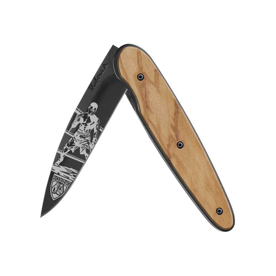 Couteau acier finition titane noir plaquette pleine bois clair motif «boxeur»