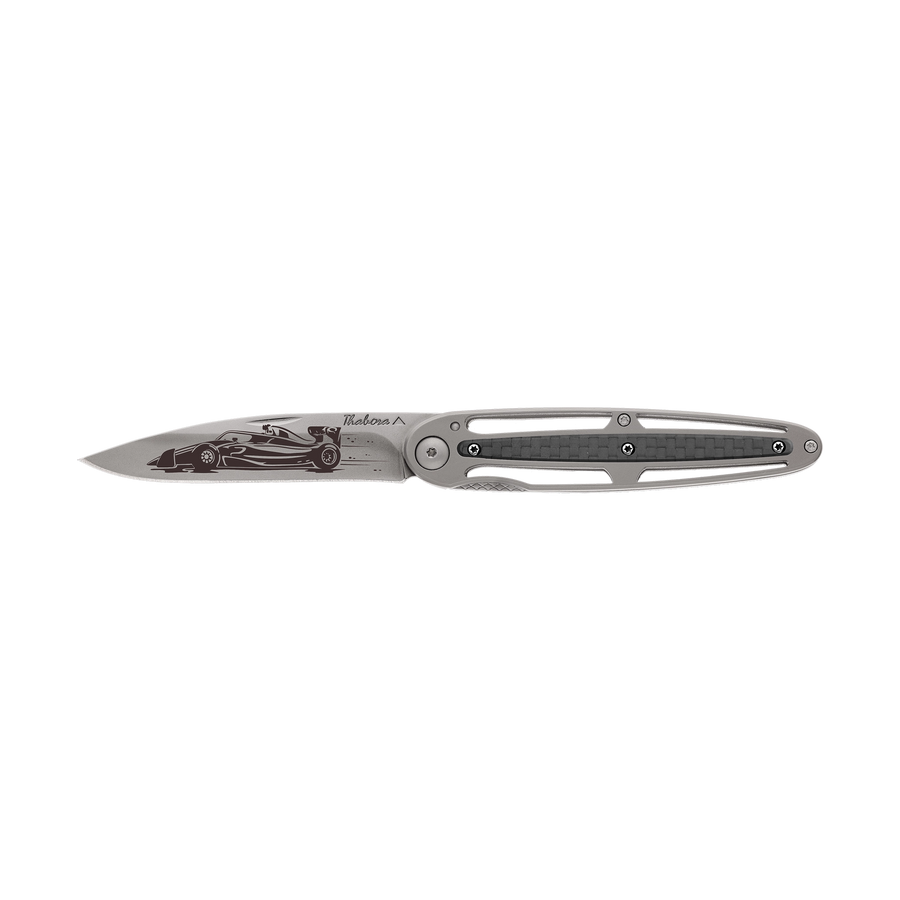 Couteau acier finition titane gris plaquette centrale carbone motif «formule 1»
