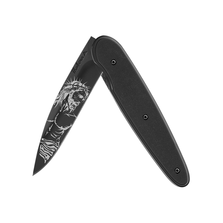 Couteau acier finition titane noir plaquette pleine résine g10 noir motif «christ»