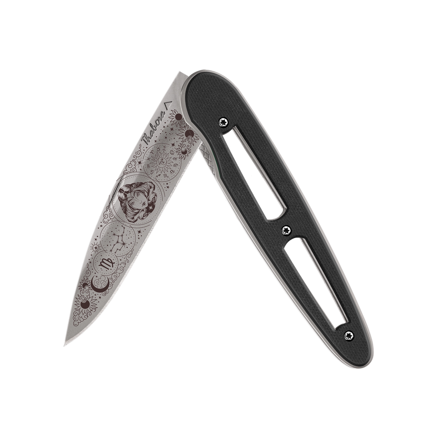 Couteau acier finition titane gris plaquette ajourée résine g10 noir motif «zodiaque vierge»