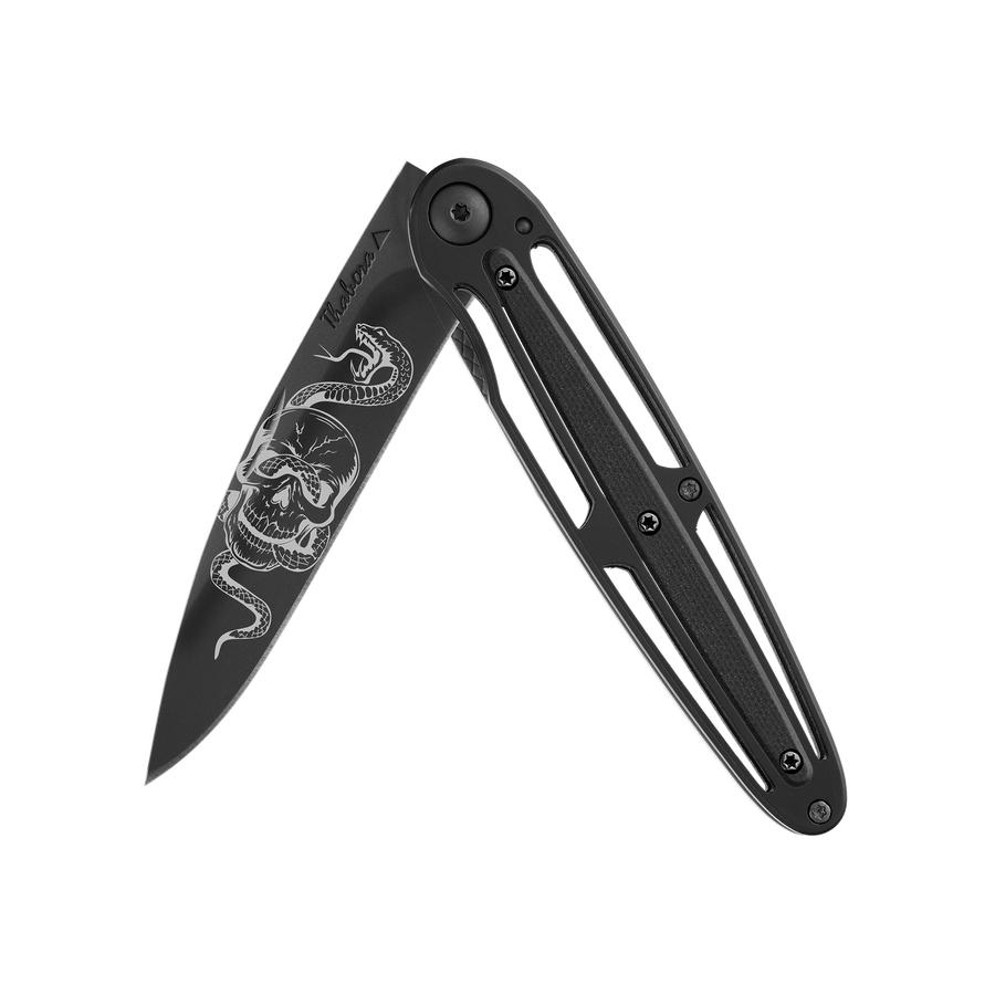 Couteau acier finition titane noir plaquette centrale résine g10 noir motif «tête de mort serpent»