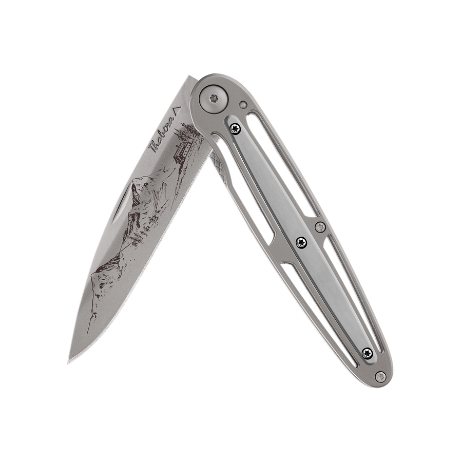 Couteau acier finition titane gris plaquette centrale acier brossé motif «montagne»