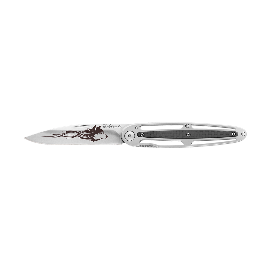 Couteau acier finition brillante plaquette centrale carbone motif «loup tribal»