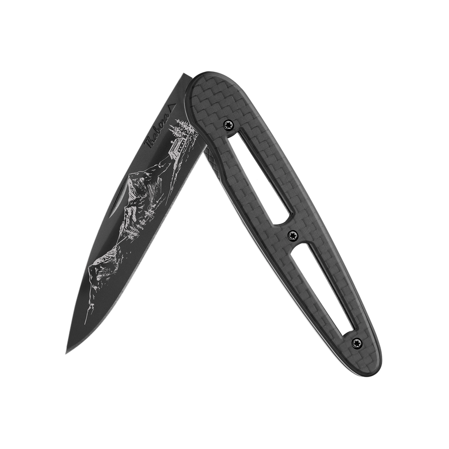 Couteau acier finition titane noir plaquette ajourée carbone motif «montagne»