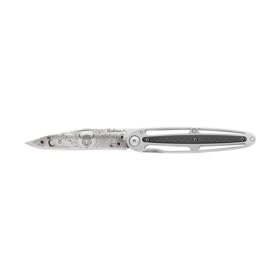 Couteau acier finition brillante plaquette centrale carbone motif «zodiaque taureau»