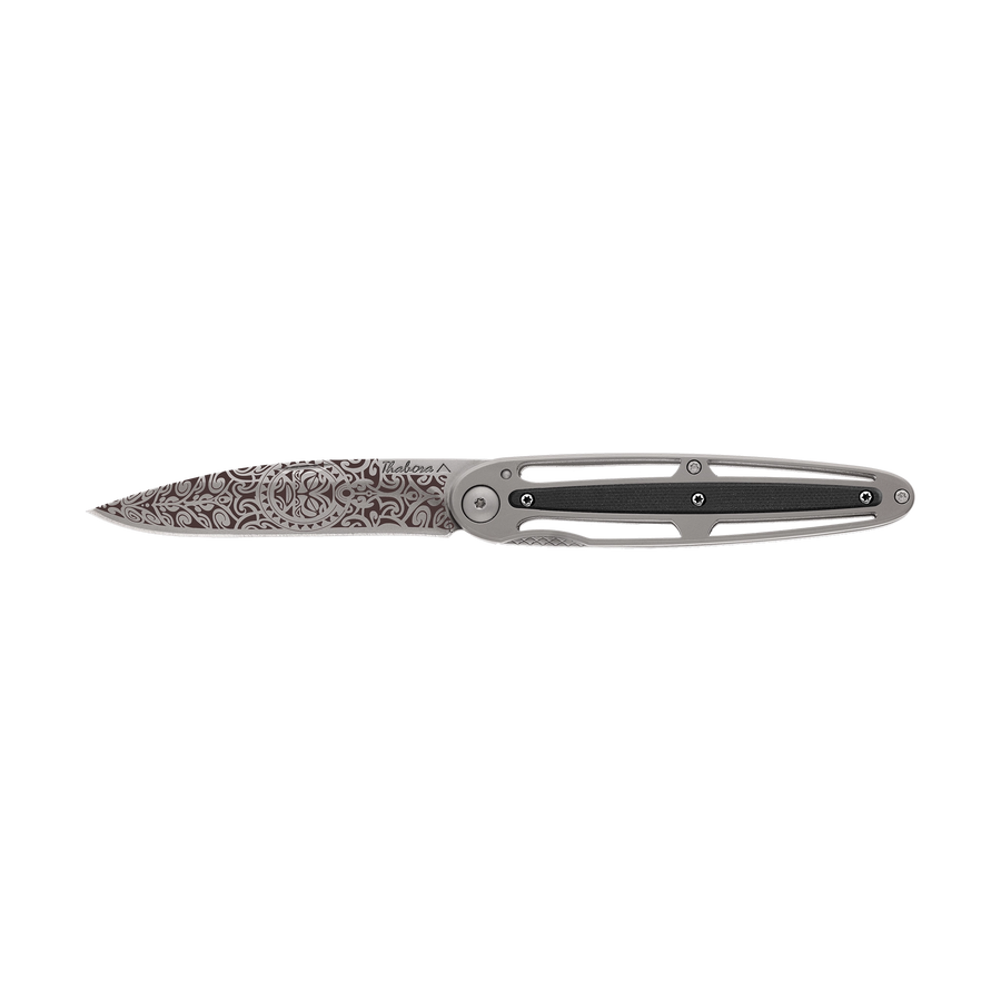 Couteau acier finition titane gris plaquette centrale résine g10 noir motif «tiki»