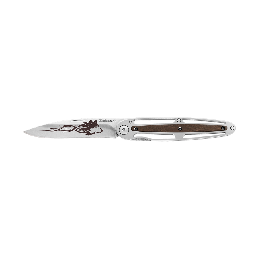 Couteau acier finition brillante plaquette centrale bois foncé motif «loup tribal»