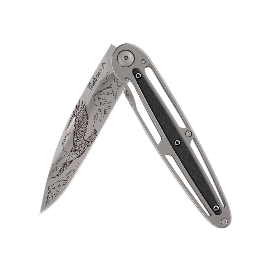 Couteau acier finition titane gris plaquette centrale résine g10 noir motif «aigle»