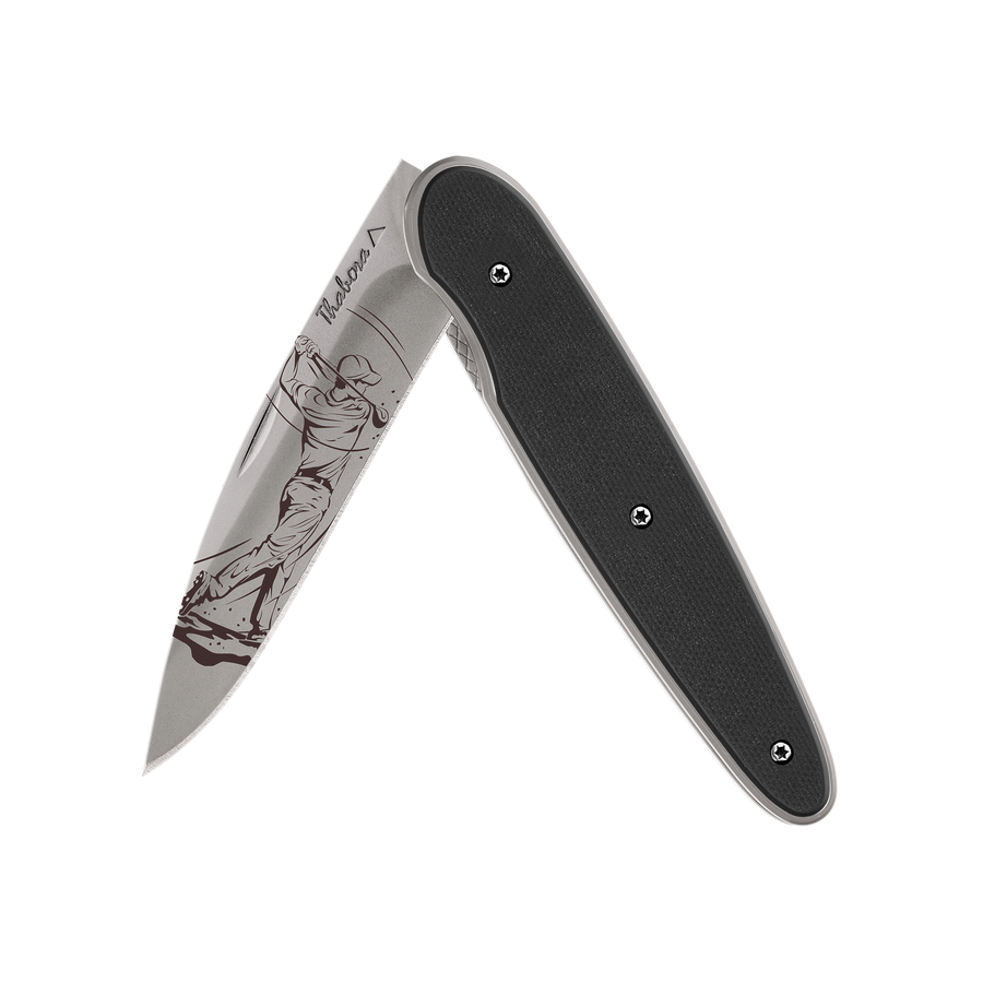 Couteau acier finition titane gris plaquette pleine résine g10 noir motif «golfeur»