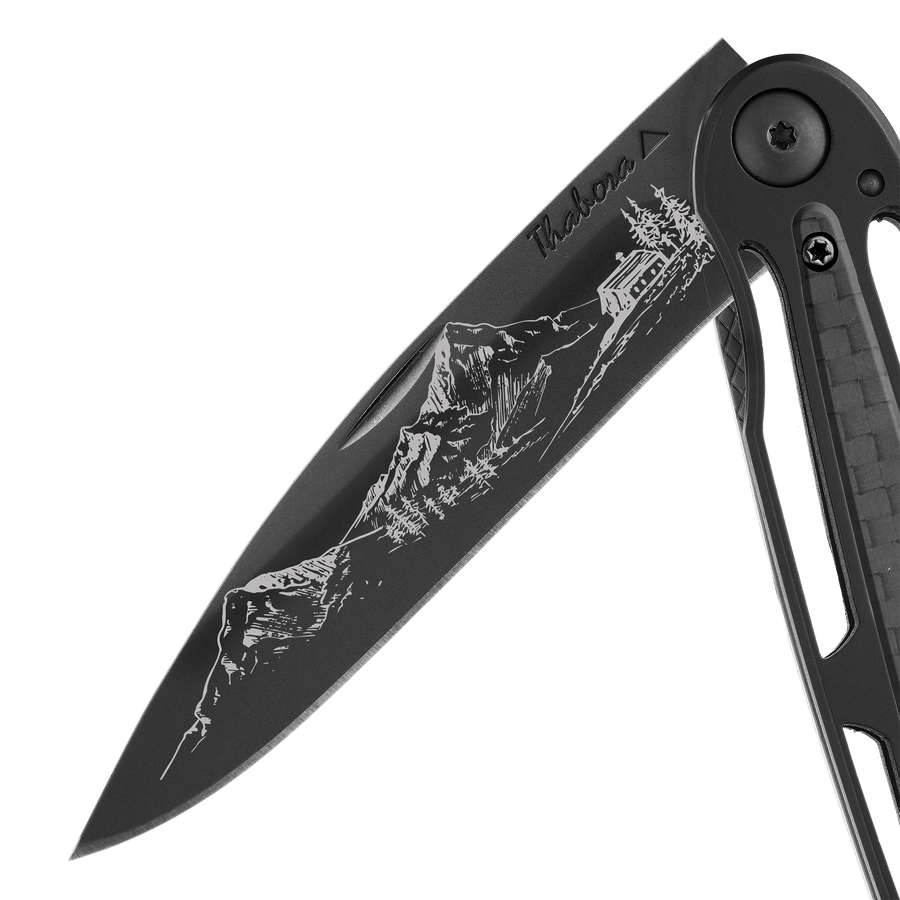 Couteau acier finition titane noir plaquette centrale carbone motif «montagne»