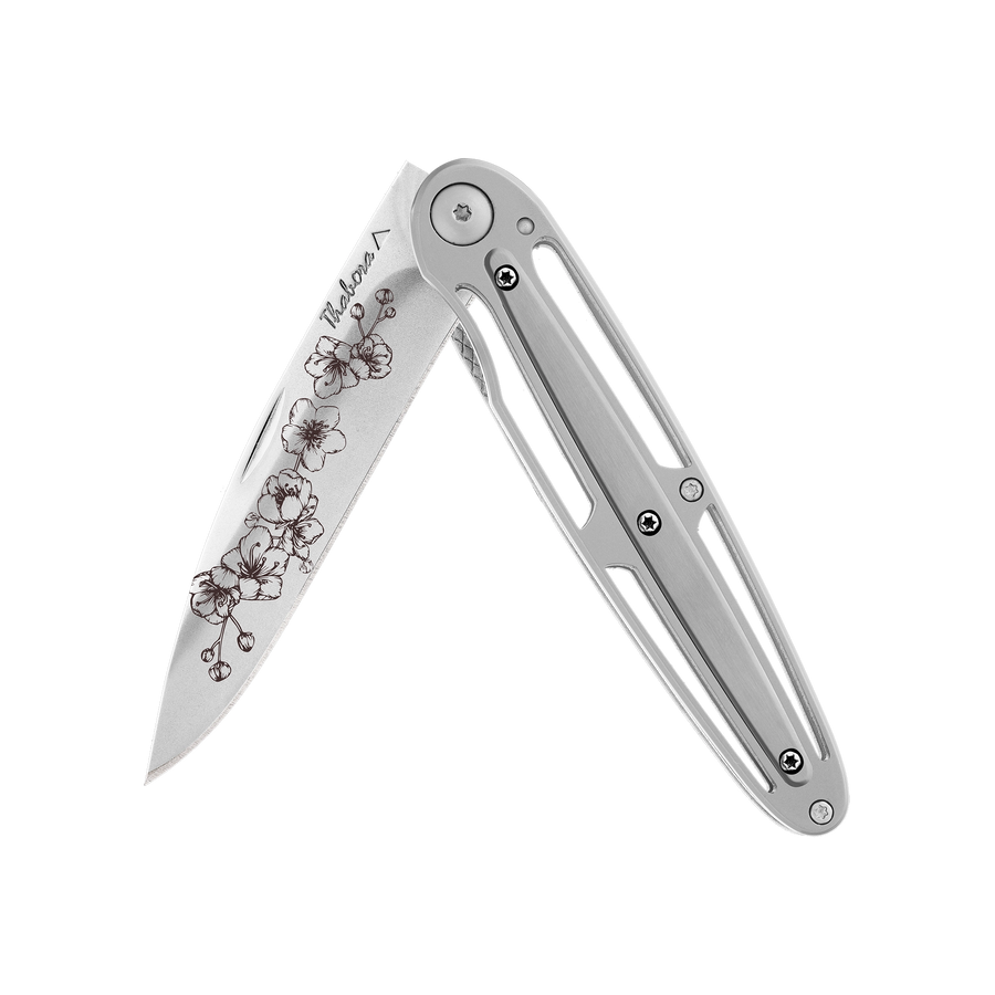 Couteau acier finition brillante plaquette centrale acier brossé motif «arbre fleuri»
