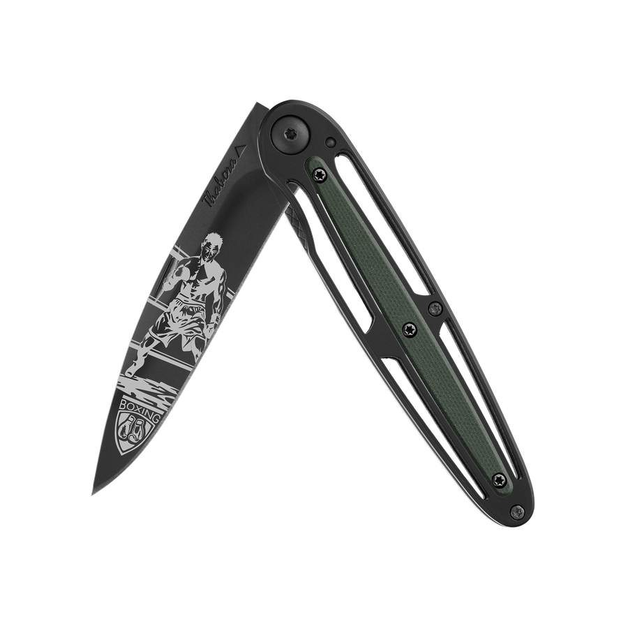 Couteau acier finition titane noir plaquette centrale résine g10 kaki motif «boxeur»