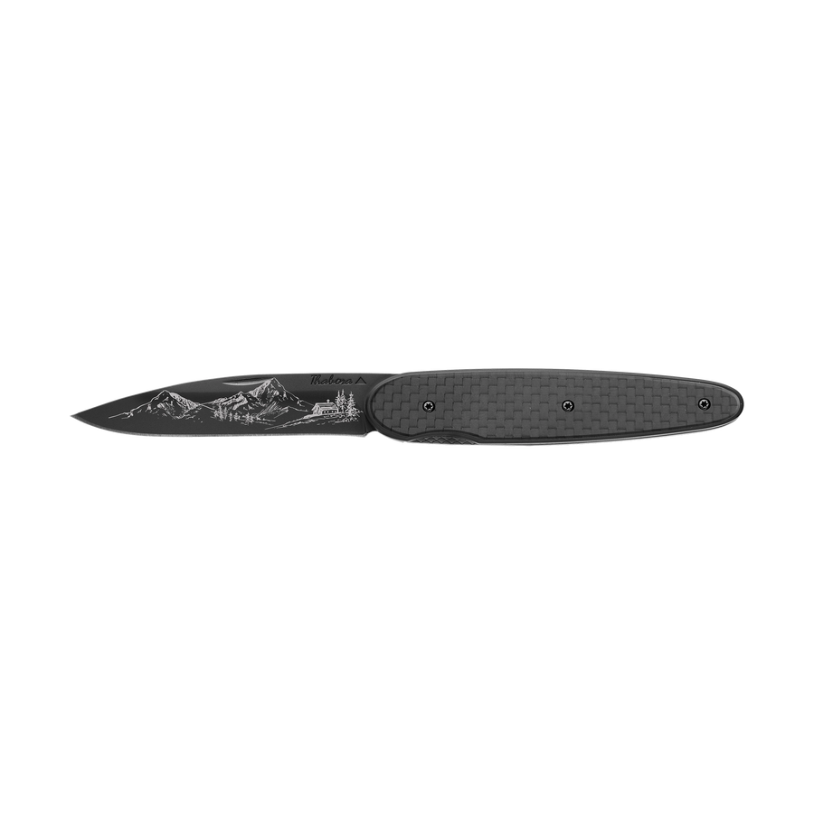 Couteau acier finition titane noir plaquette pleine carbone motif «montagne»