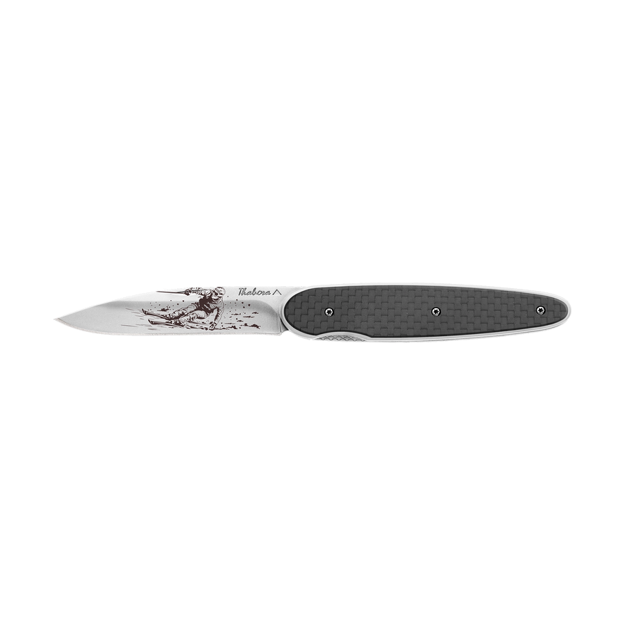 Couteau acier finition brillante plaquette pleine carbone motif «skieur»