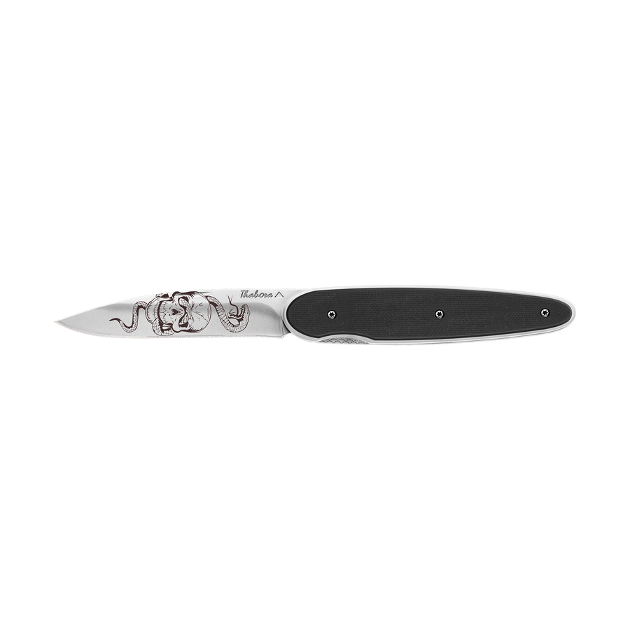 Couteau acier finition brillante plaquette pleine résine g10 noir motif «tête de mort serpent»
