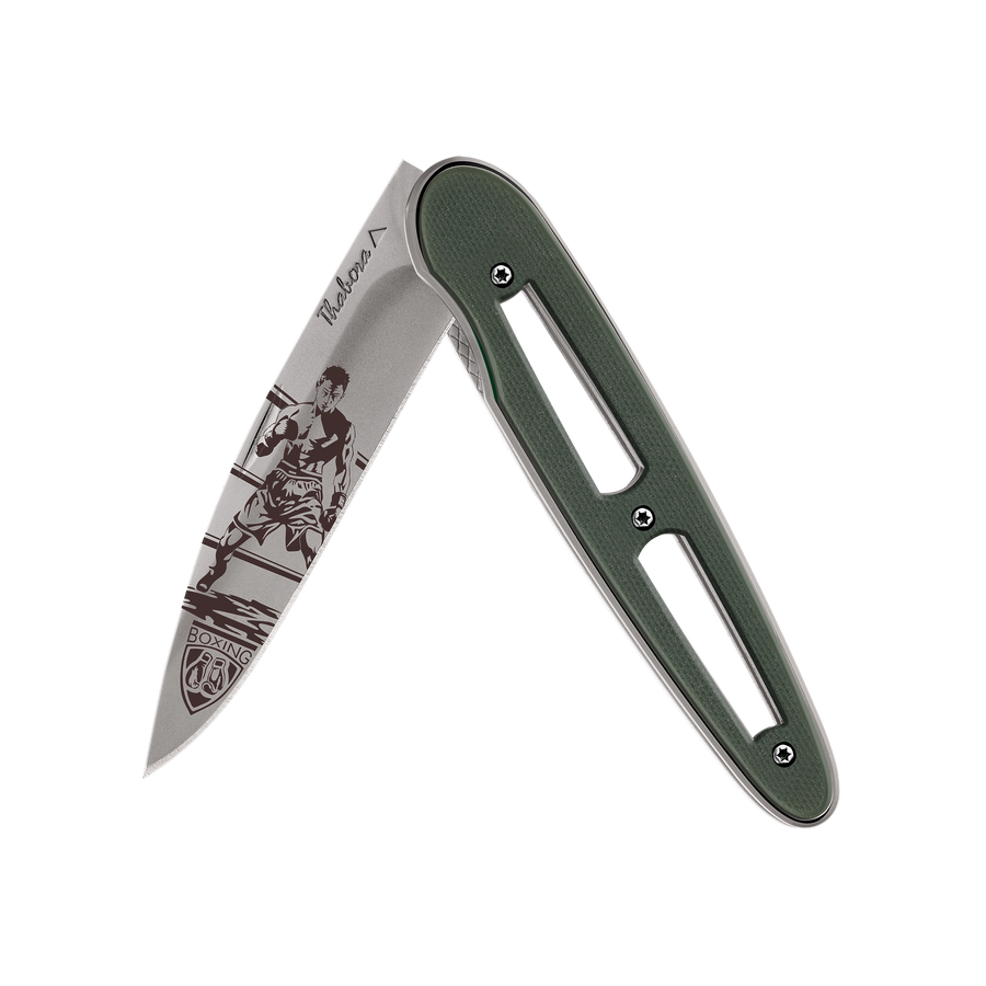 Couteau acier finition titane gris plaquette ajourée résine g10 kaki motif «boxeur»