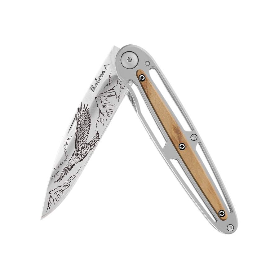 Couteau acier finition brillante plaquette centrale bois clair motif «aigle»