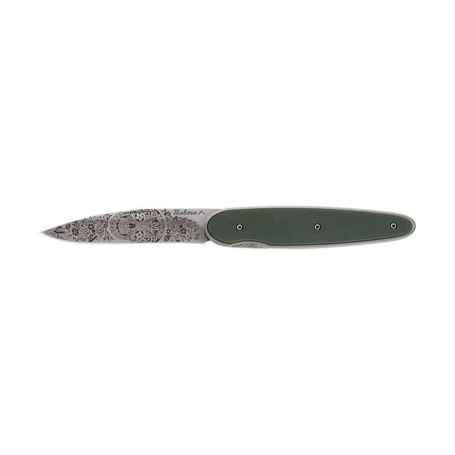 Couteau acier finition titane gris plaquette pleine résine g10 kaki motif «tête mexicaine»