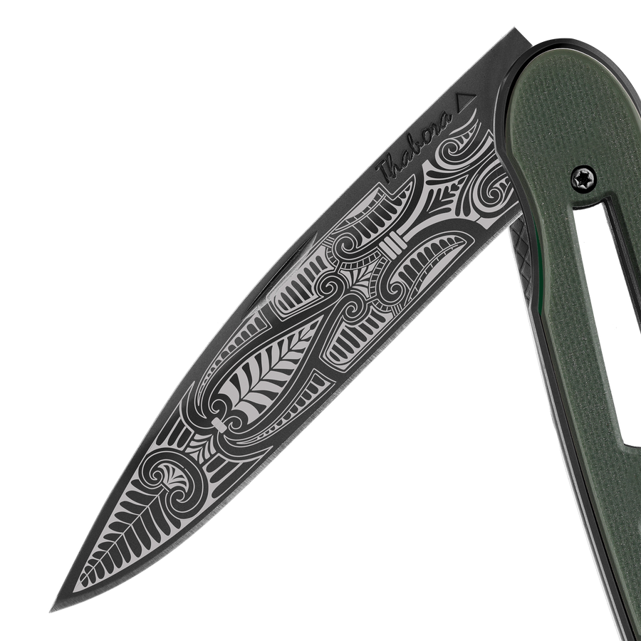 Couteau acier finition titane noir plaquette ajourée résine g10 kaki motif «cachemire»