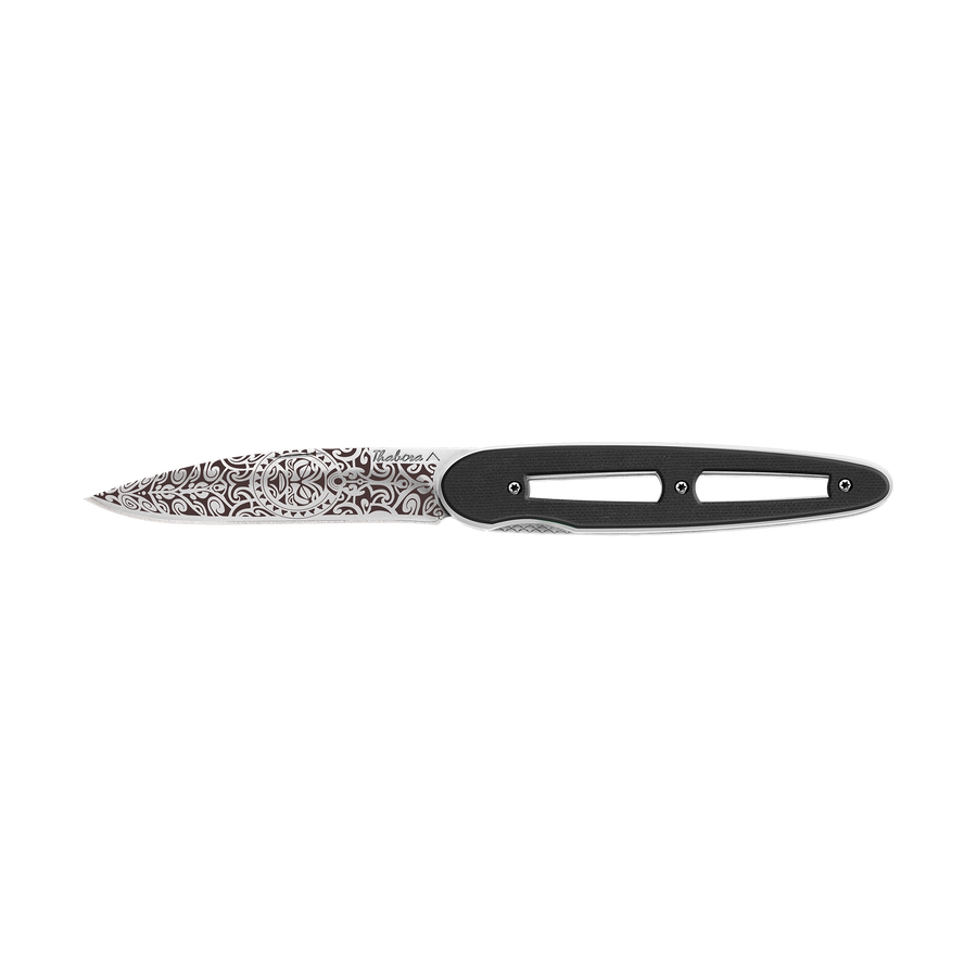 Couteau acier finition brillante plaquette ajourée résine g10 noir motif «tiki»