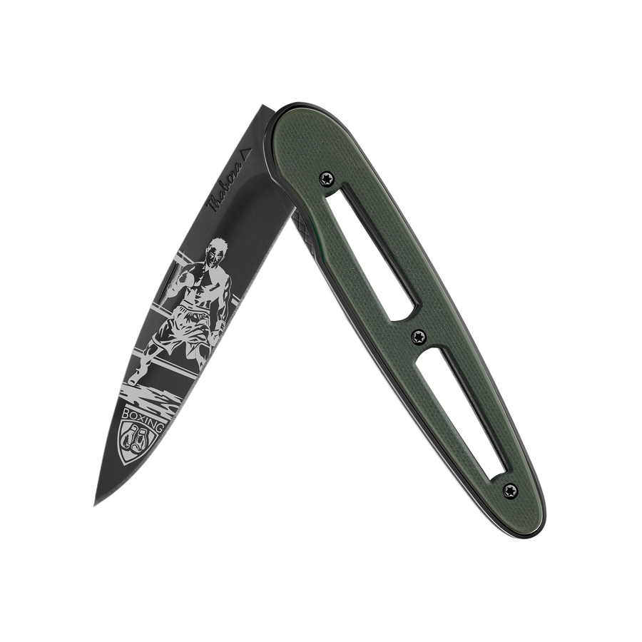 Couteau acier finition titane noir plaquette ajourée résine g10 kaki motif «boxeur»