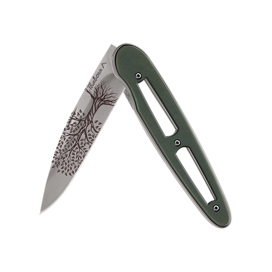 Couteau acier finition titane gris plaquette ajourée résine g10 kaki motif «arbre de vie»