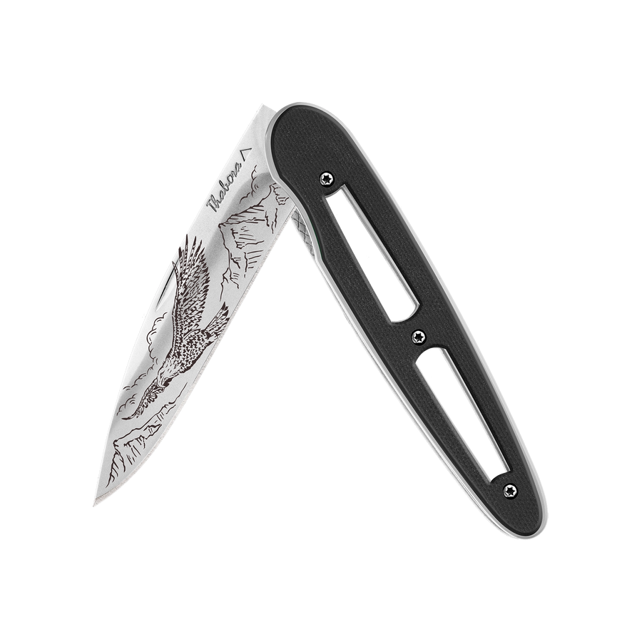 Couteau acier finition brillante plaquette ajourée résine g10 noir motif «aigle»