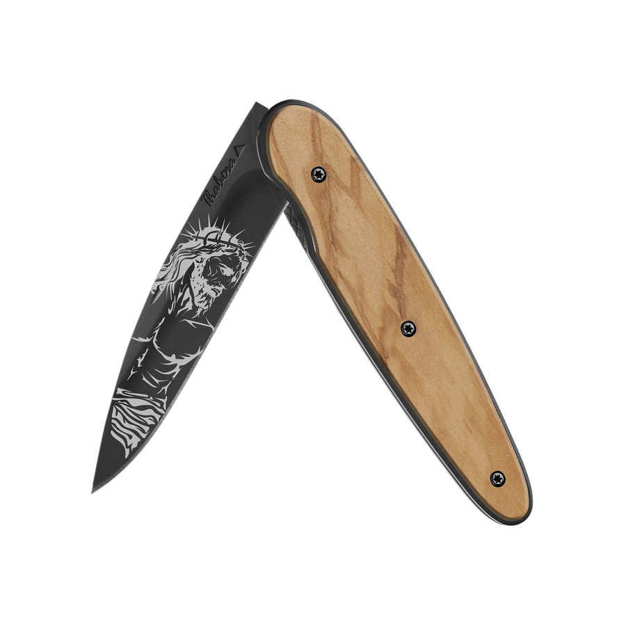 Couteau acier finition titane noir plaquette pleine bois clair motif «christ»
