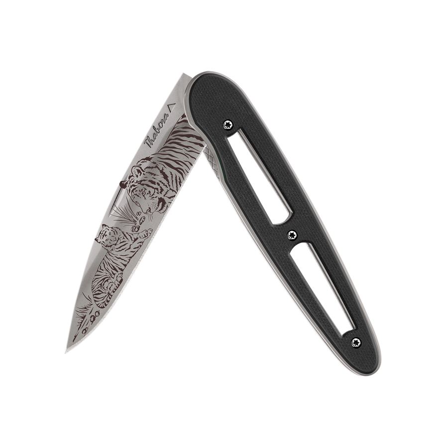 Couteau acier finition titane gris plaquette ajourée résine g10 noir motif «tigres»