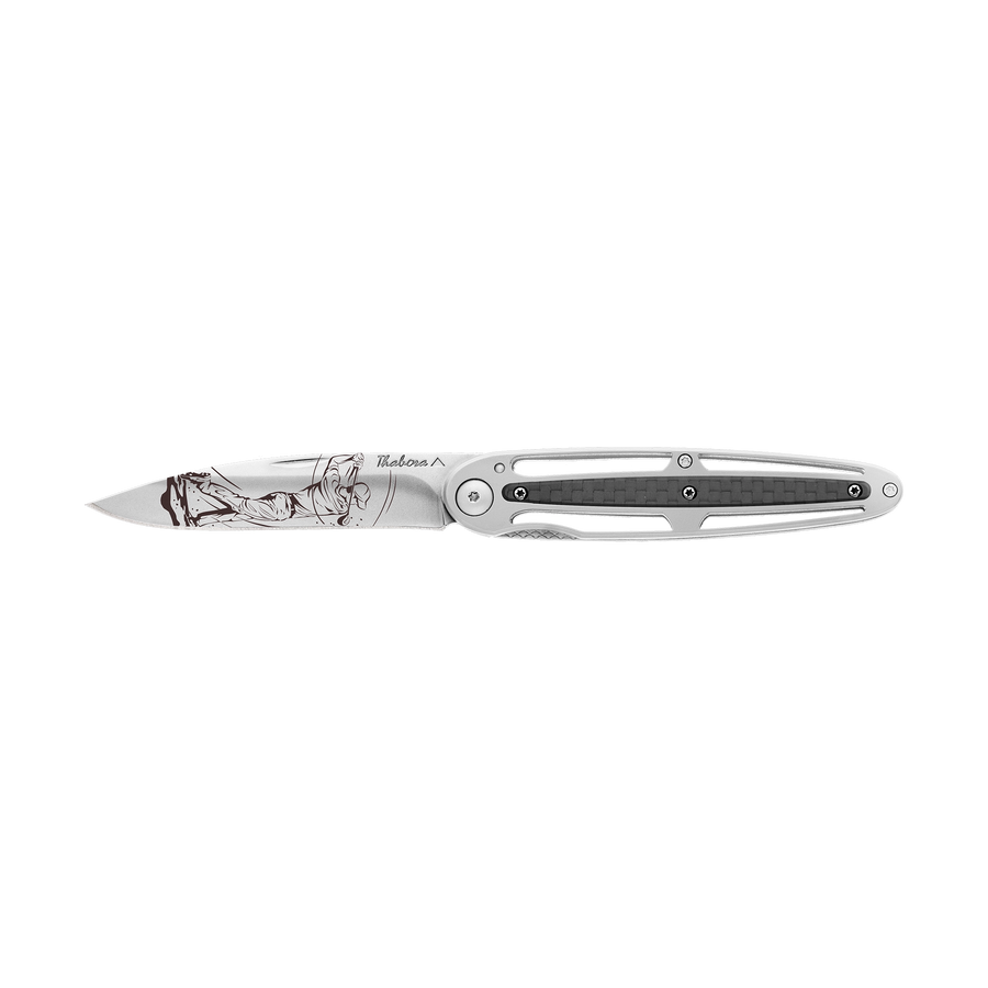 Couteau acier finition brillante plaquette centrale carbone motif «golfeur»