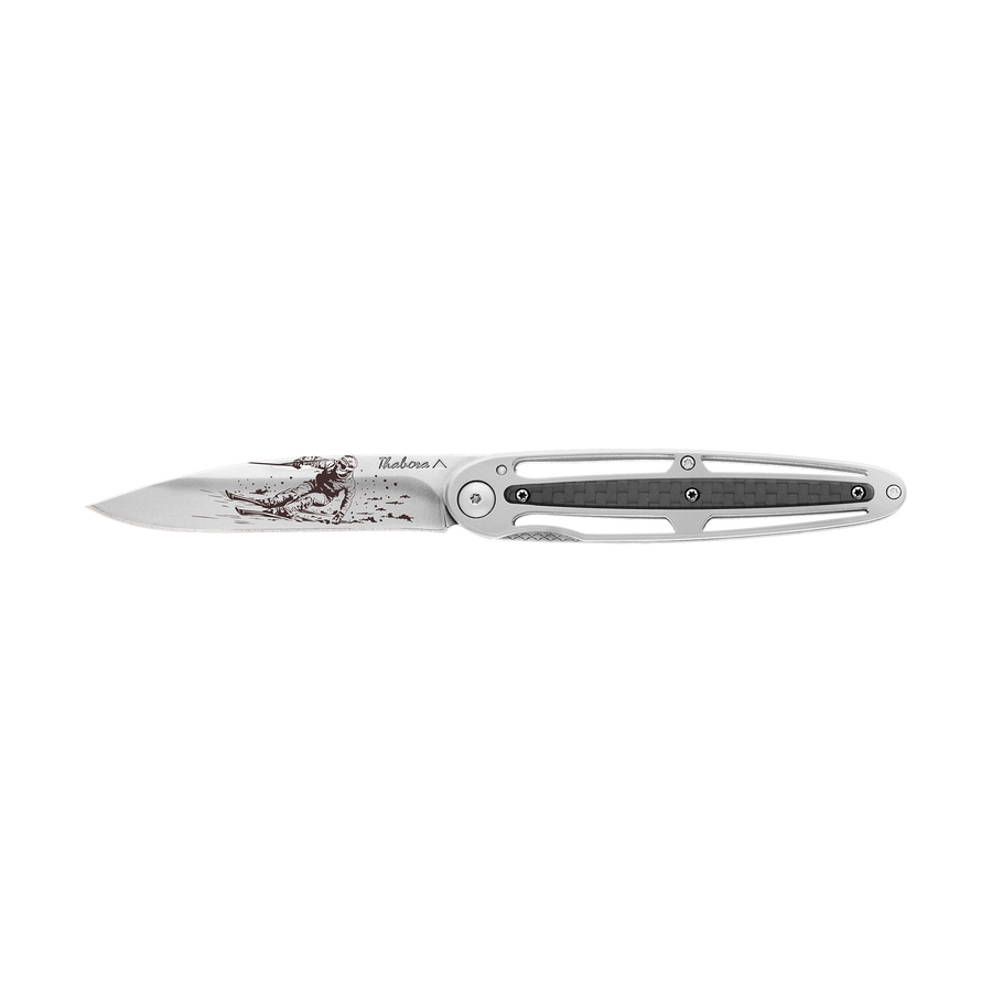 Couteau acier finition brillante plaquette centrale carbone motif «skieur»