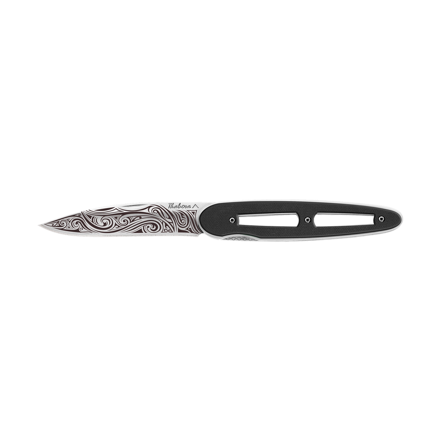 Couteau acier finition brillante plaquette ajourée résine g10 noir motif «volutes»