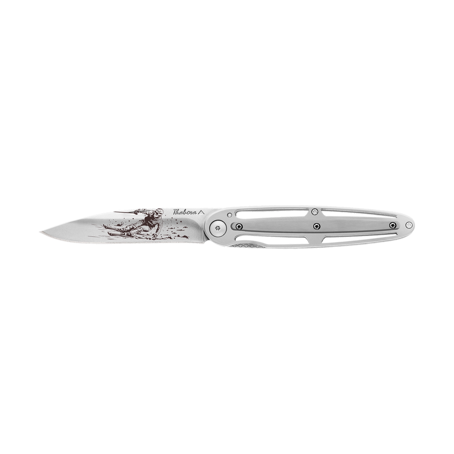 Couteau acier finition brillante plaquette centrale acier brossé motif «skieur»