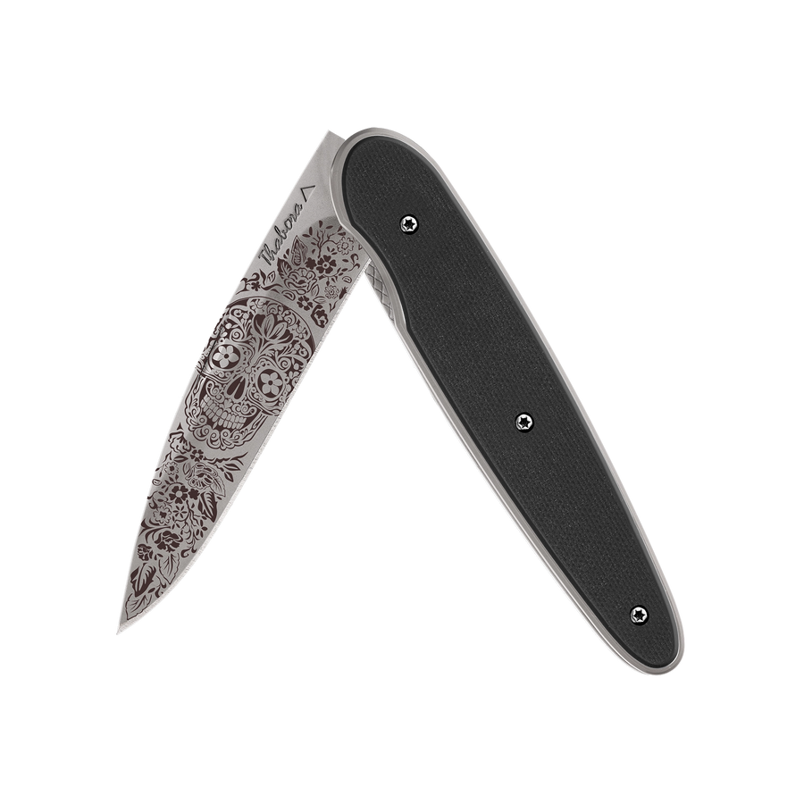 Couteau acier finition titane gris plaquette pleine résine g10 noir motif «tête mexicaine»