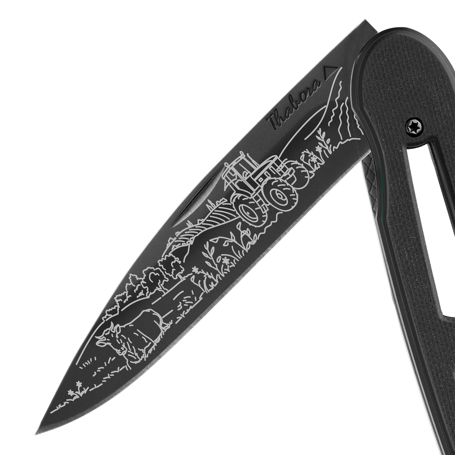 Couteau acier finition titane noir plaquette ajourée résine g10 noir motif «campagne»