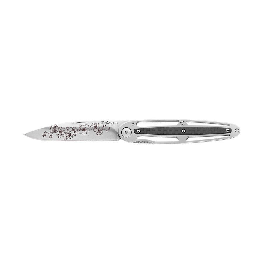 Couteau acier finition brillante plaquette centrale carbone motif «arbre fleuri»