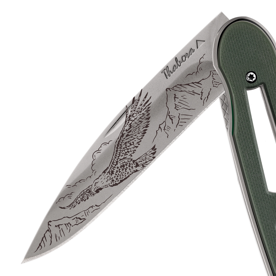 Couteau acier finition titane gris plaquette ajourée résine g10 kaki motif «aigle»