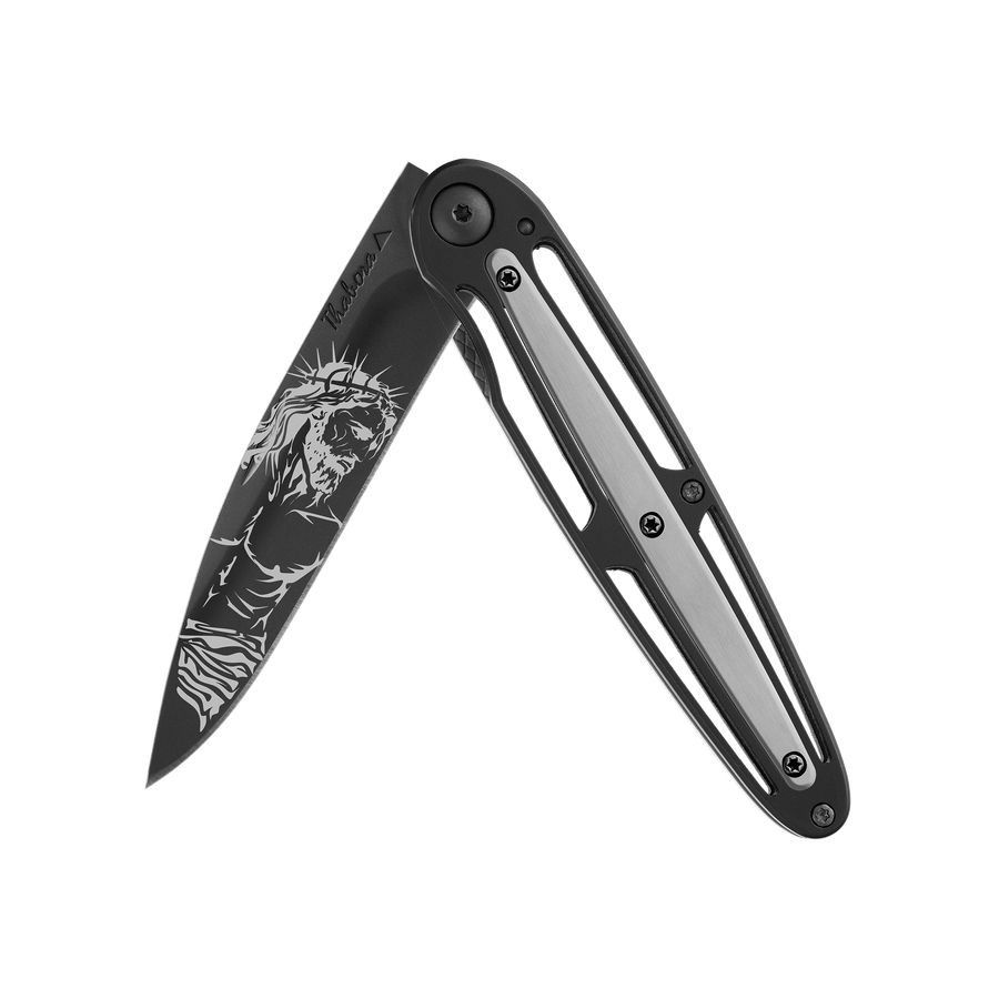 Couteau acier finition titane noir plaquette centrale acier brossé motif «christ»